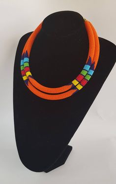 100% handcrafted using fine beads. The 2 strands are joined together to make one piece. Measurements; 19 inches for the long strand and 18 inches for the short one. **Buy multiple items and pay shipping for 1 item only.The rest ships free. More neckleces here; https://www.etsy.com/shop/TribalTess?ref=seller-platform-mcnav&section_id=21306083 Back to my shop; https://www.etsy.com/shop/TribalTess?ref=seller-platform-mcnav Traditional Handmade Double Strand Beaded Necklaces, Traditional Handmade Double Strand Beaded Necklace, Orange Double Strand Beaded Necklace As Gift, Orange Double Strand Beaded Necklace For Gift, Double Strand Polished Bead Necklaces, Double Strand Polished Beads Necklace, Handmade Orange Double Strand Necklace, 2 In 1 Necklace, African Wedding Jewelry