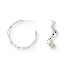 Discover flowing shapes and a perfect wave for every day. These airy, light earrings are a twist on the classic hoops and stand out with a dreamy, playful look. They'll let you stand out and shine.  The Poise Wave Hoop Earrings Large with their elegant design bring a unique, modern touch to your outfit. Minimalist silver jewelry, designed in Berlin. Made from recycled sterling silver with a polished finish. Our Sterling silver jewelry is crafted from 100% recycled Sterling silver, and features a Outfit Minimalist, Hoop Earrings Large, Light Earrings