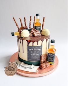 a cake decorated with liquor bottles and candies