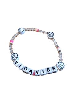 Beaded Volleyball VidaVibe Bracelet! The childhood friendship bracelets gets an extra chi look! The stackable style features a strand of fun beads, with silver accents and bold lettering that spells out “VIDAVIBE.” What's your VidaVibe? Get ready to be inspired! Live. Love. Play. It’s a great gift idea for friend, sister, BFF, teammates. It’s a perfect gift for birthday, Valentine's day, Christmas, graduation, or any other gift giving occasions for women. 3 Bracelets for $15, No Code Needed! White Beaded Bracelets For Friendship, Sporty White Beaded Bracelets For Friendship, Volleyball Bracelets Diy, Volleyball Accessories Diy, Fun White Wristband With Letter Beads, Volleyball Beaded Bracelets, Volleyball Motivation Gifts, Volleyball Necklace Jewelry, Childhood Friendship