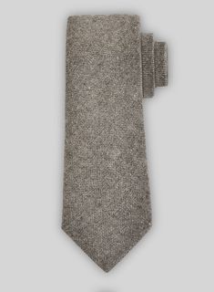 This Tweed Tie is hand crafted with premium finish.  Perfect for suits and blazers, it adds a unique touch with its solid design.  Must-have for any neckwear collection.  Width: 2.75 inches. Brown Tweed, Must Haves, Hand Crafted, Blazer, Design