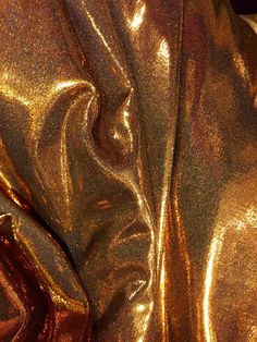 a close up view of a shiny gold jacket