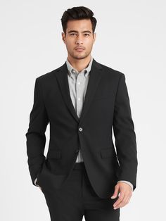 You asked for it, our designers delivered.  This is a sharply tailored suit in a slimmer-than-slim fit, made with lightweight, stretch wool from Italian mill Marzotto.  Plus, our designers added a special pocket at the hip big enough to fit a phone or even a flask—we won't tell… Fully lined with stretch lining for extra comfort.  Underarm shields reduce the need for dry cleaning.  Under-collar melton helps keep shape and adds style when the collar is turned up.  Notch lapel.  Two-button closure. Fitted Single Button Tuxedo For Business Casual, Modern Slim Fit Single Breasted Suit, Slim Fit Single Button Tuxedo For Business Casual, Professional Slim Fit Tuxedo For Business Casual, Fitted Tuxedo With Hidden Button Closure For Business Casual, Fitted Sport Coat With Suit Collar For Business Casual, Modern Fitted Sport Coat For Semi-formal Occasions, Single Button Fitted Sleek Suits, Fitted Sleek Office Suits