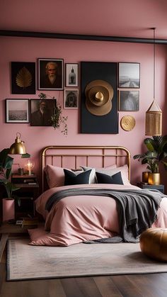 a bedroom with pink walls and pictures on the wall