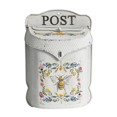 a white mailbox with a bee painted on it's front and the word post