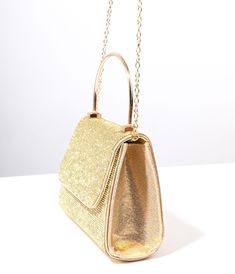 This glamorous 1950s inspired mini handbag is the perfect way to add a touch of sparkle and sophistication to any outfit. With its eye-catching gold rhinestone detailing and luxurious metallic finish, this handbag exudes excitement and elegance. The convenient magnetic snap closure ensures easy access while keeping your belongings secure. Plus, the inner slip pocket provides additional organization for all your essentials. Wear it as a chic clutch or effortlessly switch it up with the removable Rhinestone Mirror, Mini Handbag, Mini Handbags, Gold Rhinestone, Hands Free, Unique Vintage, Easy Access, Snap Closure, Shoulder Strap