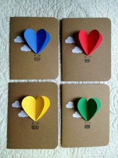 four different colored paper hearts on top of a brown card board with the words, uploaded by natalie 2b beach