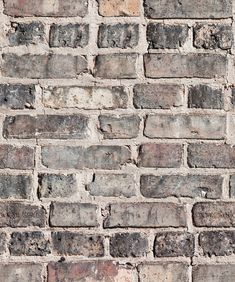 an old brick wall is shown in this image