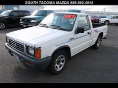 a white pick up truck with a for sale sign on it