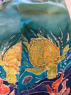 a bag with an image of a turtle and corals in the water on it