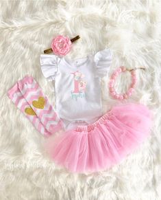 ♥ Personalized Ballerina First Birthday Tutu Outfit ♥This sweet Ballerina First Birthday Tutu Outfit is sure to be a special addition to your little one's first birthday. Bodysuit has 3 snap closure and expandable shoulders, 100% cotton. Leg warmers are soft and stretchy. Keep your little one warm and stylish! Also perfect for protecting knees for crawling babies. Adorable chevron pattern with gold glitter hearts. Necklace is adjustable. Never leave babies left unattended with necklace. These bo Cute White First Birthday Sets, Playful White Sets For Birthday, Sweet Pink Sets For Birthday, Sweet White Sets For Birthday, Sweet Pink Birthday Sets, Sweet Pink Birthday Set, Pink First Birthday Sets For Spring, Pink Sets For First Birthday In Spring, Cute Pink First Birthday Sets