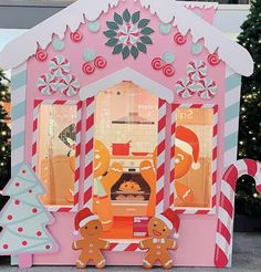 a pink gingerbread shop with christmas decorations