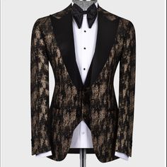 a mannequin wearing a black and gold tuxedo