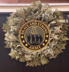 a wreath made out of dollar bills with the words pray and strong army on it