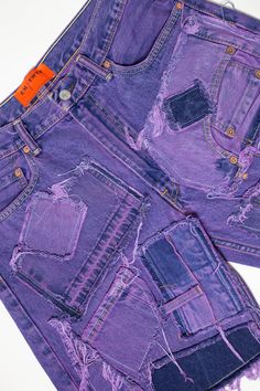 The Knotwtr Purple Patched Denim Shorts are crafted from top-quality denim, offering an ideal blend of comfort, breathability, and style. Each pair is meticulously handcrafted from repurposed vintage jeans, guaranteeing that every piece is truly one-of-a-kind.With their vibrant purple patches, these shorts make a bold statement while promoting sustainability. Enjoy the confidence of a customized look that reflects your individuality, all while supporting eco-friendly fashion with our stylish Kno Pre-washed Recycled Denim Blue Bottoms, Purple Relaxed Fit Straight Leg Jeans, Pre-washed Denim Blue Recycled Denim Bottoms, Customized Denim, Descendants Dr, Patched Denim, Repurposed Denim, Recycled Jeans, Repurposed Vintage