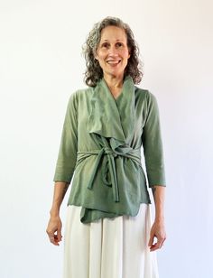 The Cocoon Jacket is the perfect grab-and-go jacket when you need an extra layer. A year-round layering design with sophisticated and effortless drape. This jacket is excellent for travel and is sure to become a staple garment. Belted – Ties attached at the side seams made from Lycra blended fabric for extra stretch. Size - Order based on your BUST measurement Fabric Shown - Heavy Hemp/Organic Cotton Knit, Light Hemp/Organic Cotton Knit, Stretch Organic Cotton Knit, NC Grown Organic Cotton Knit Layering Design, Cocoon Jackets, Above Elbow, Belted Jacket, Fabric Bolts, Elbow Sleeve, Organic Fabrics, Clothing Care, Cotton Knit