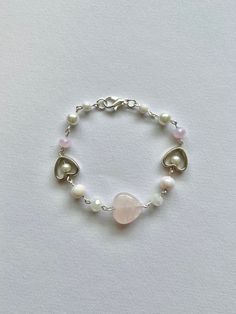 super cute pink rose quartz heart beaded bracelet! a perfect gift for a crystal lover!  made with rose quartz bead, glass beads, small acrylic beads, and stainless steel findings! Heart Rose Quartz, Heart Rose, Diy Bracelet Designs, Rose Quartz Heart, Rose Quartz Beads, Diy Bracelet, Quartz Rose, Heart Beads, Acrylic Beads