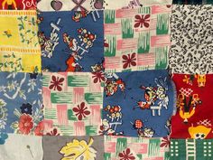 a patchwork quilt with many different designs on it