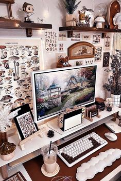 a computer on a desk with lots of decorations