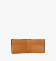 Small Bifold Wallet in Visetos Original Cognac | MCM ®US Designer Trifold Wallet With Card Slots For Business, Designer Business Wallets With Interior Card Slots, Designer Bifold Wallet With Interior Card Slots, Designer Bifold Wallets With Card Slots, Designer Trifold Wallet With Coin Pocket For Everyday Use, Designer Trifold Wallet With Coin Pocket For Business, Designer Trifold Wallet With Interior Card Slots For Business, Designer Trifold Wallet With Interior Card Slots, Luxury Wallets With Coin Pocket For Everyday