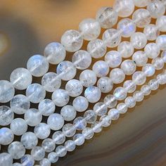 three strands of white glass beads