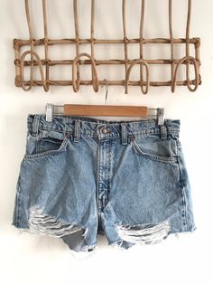 "Waist:32\" Rise:11.5\" Hips:39\" Inseam:2\" These are shown on a size 32\" model and are tagged a 34\" but are true vintage and run small. They're rad 90's 505 cutoffs with the rare orange Levis tab and tons of distress and rips by the raw hem. They're the perfect edgy summer shorts to pair with your Harley crops and band tees. 🍑(15)" Ripped High-rise Relaxed Fit Jean Shorts, Ripped High Rise Jean Shorts With Relaxed Fit, Ripped High Rise Relaxed Fit Jean Shorts, Distressed Straight Leg Jean Shorts For Summer, Distressed Jean Shorts With Straight Leg For Summer, Summer Distressed Straight Leg Jean Shorts, Summer Straight Leg Distressed Jean Shorts, Summer Jean Shorts Distressed Straight Leg, Distressed Cutoff Jean Shorts