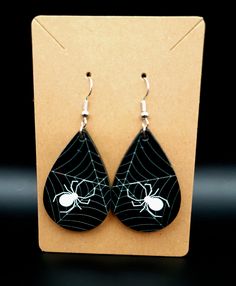 Sublimation printed Halloween earrings. Single sidded. Can be customized Spooky Handmade Earrings For Halloween, Spooky Handmade Halloween Earrings, Handmade Spooky Halloween Earrings, Handmade Spooky Black Earrings, Handmade Black Halloween Earrings, Nickel-free Black Spooky Earrings, Black Halloween Earrings Gift, Spooky Hypoallergenic Jewelry For Halloween, Gothic Hypoallergenic Halloween Earrings