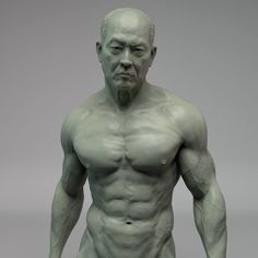 a statue of a man with no shirt on standing in front of a gray background