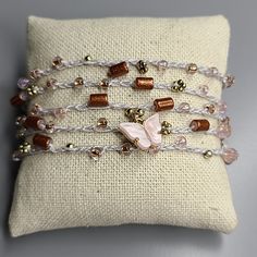 Women's Wrap Bracelet Light Gray Gold Blush Pink Beads Butterfly Handmade Cute Perfect For The Butterfly Lover. One Of A Kind Wrap Bracelet With Button Closure. Great Lightweight Piece To Wear Layered With Other Accessories. Very Versatile, Shown As An Anklet As Well. Makes A Great Gift. 38 In. Total Length. Designed And Handmade In Las Vegas, Nevada I'd Love To Accept Your Offer! Smoke-Free Seller. Fast Shipping. Trusted Long-Time Seller. All Items Are In Euc Unless Otherwise Stated. Thank You Beaded Wrap Bracelet As Gift, Adjustable Pink Hand-strung Wrap Bracelet, Adjustable Hand-strung Pink Wrap Bracelet, Rose Gold Beaded Bracelet Jewelry, Pink Bracelet With Gold Beads As Gift, Adjustable Rose Gold Beaded Chain Jewelry, Pink Bracelets With Gold Beads For Beach, Adjustable Pink Beaded Wrap Bracelet, Rose Gold Beaded Bracelets Colorful Beads Gift