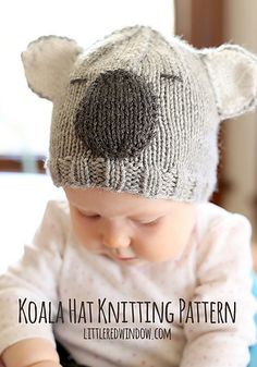 a baby wearing a knitted bear hat