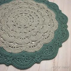 a crocheted doily is shown on the floor