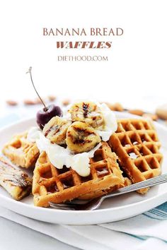 banana bread waffles with whipped cream and cherries on white plate next to fork