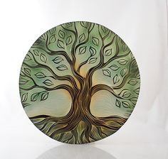 a glass plate with a tree painted on it