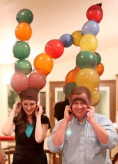 two people with balloons on their heads