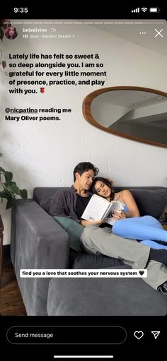 a man and woman sitting on a couch with a book in front of their face