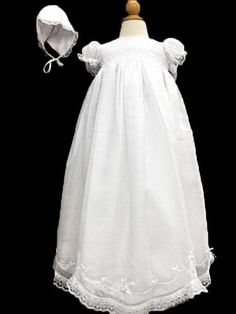 a white dress and bonnet are on display