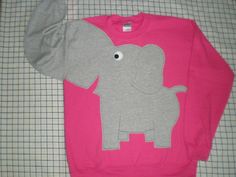 "UPcycled from NEW sweatshirts, crew neck sweatshirt in a 80% cotton 20% polyester blend with elephant applique and trunk sleeve. All my appliques are designed by me, hand cut, and sewn by me, NOT just stuck on, so there will be no fear that your ear may fall off later. These are adult unisex sizes, please choose your size a purchase. Small 40\" chest Medium 44\" chest Large 48\" chest X-large 52\" chest" Elephant Sweater, Elephant Sweatshirt, Elephant Applique, Animal Sweater, Elephant Shirt, Elephant Trunk, Large Sweaters, Pinterest Closet, Pink Elephant