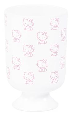 a white cup with pink hello kitty designs on it