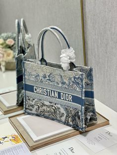 Description Christian Dior Medium Dior Book Tote Blue Toile de Jouy Reverse Embroidery, Blue, For Women Womens Handbags, Shoulder Bags,... Reverse Embroidery, Dior Aesthetic, Embroidery Blue, Dior Book, Louis Vuitton Shirt, Chanel Shirt, Blue Toile, Dior Book Tote, Maria Grazia