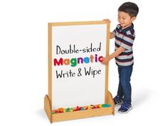 a little boy standing next to a white board with magnets on it that says, double - sided magnetic write & wipe