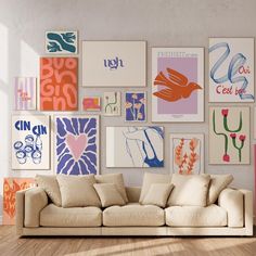 a living room filled with lots of art on the wall