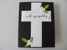 a black and white card with a cross on it that says,'with sympathy '