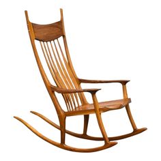 a wooden rocking chair on a white background