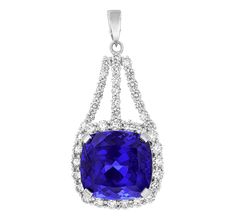 An astounding 31.24-carat cushion-cut tanzanite is set in this pendant. The gem displays a highly saturated "bluish-violet" hue as stated in its certification from the Gemological Institute of America (GIA). Its suspended form is encased by a halo of white diamonds, which total approximately 3.10 carats. Set in 18K white gold. When discovered in the hills of Mount Kilimanjaro in 1967, tanzanites were first thought to be an alternative type of sapphire. Upon further investigation, however, the stone’s properties were seen to be more complex and unique. The stone was christened with the name “Tanzanite” by Henry B. Platt, president and chairman of Tiffany & Co., at the 1968 World's Fair, where its vibrant blue-violet color dazzled visitors. While many tanzanites display a light, violet hue, Golconda Diamond, Tanzanite Pendant, Light Violet, Mount Kilimanjaro, Violet Color, World's Fair, Blue Violet, Fine Jewels, Vibrant Blue