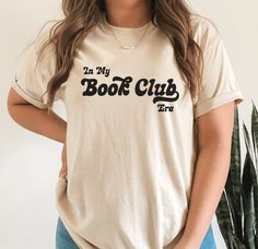 In My Book Club Era Shirt Wear your love for books on your sleeve with this exceptional bookish t-shirt and let the world know that you're a true literary enthusiast. Whether you're a die-hard fan of classic literature or a lover of contemporary fiction, this shirt is the perfect way to celebrate your love of reading. This design is available on other items: ✧ Crewneck:  https://www.etsy.com/listing/1449395872/book-club-sweatshirt-bookish-crewneck ✧ Hoodie https://www.etsy.com/listing/1464062707 Book Worm Gifts, Bookish Shirts, Booktok Aesthetic, Library Shirt, Book Club Gifts, Library Tote Bag, Book Club Shirt, Aesthetic Reading, Club Aesthetic