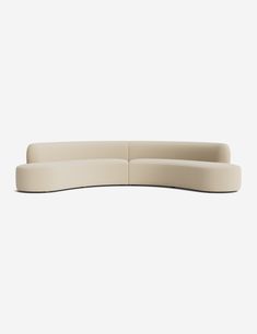 the curved sectional sofa is shown in beige leather, and has a rounded backrest