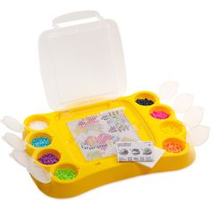 an assortment of beads in a yellow plastic container with white lid and clear dividers