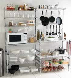 a kitchen shelving unit with pots and pans