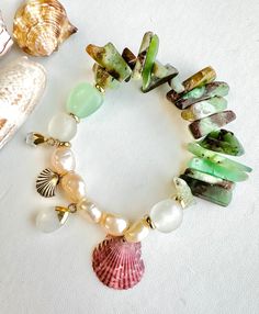 Beachy Shell Bracelet Jewelry, Ocean-inspired Shell Oyster Bracelet Jewelry, Ocean-inspired Shell Oyster Bracelet, Bohemian Shell Bracelets As Gift, Bohemian Shell Bracelets For Gifts, Bohemian Handmade Beaded Bracelets With Shell-shaped Beads, Bohemian Handmade Shell-shaped Bracelets, Handmade Bohemian Beaded Bracelets With Shell-shaped Beads, Bohemian Handmade Shell-shaped Beaded Bracelets