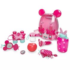 a pink minnie mouse backpack with accessories and items in it on a white background,